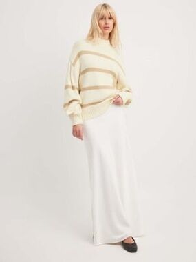 Off-white knitted turtleneck sweater with horizontal tan stripes from NA-KD.
